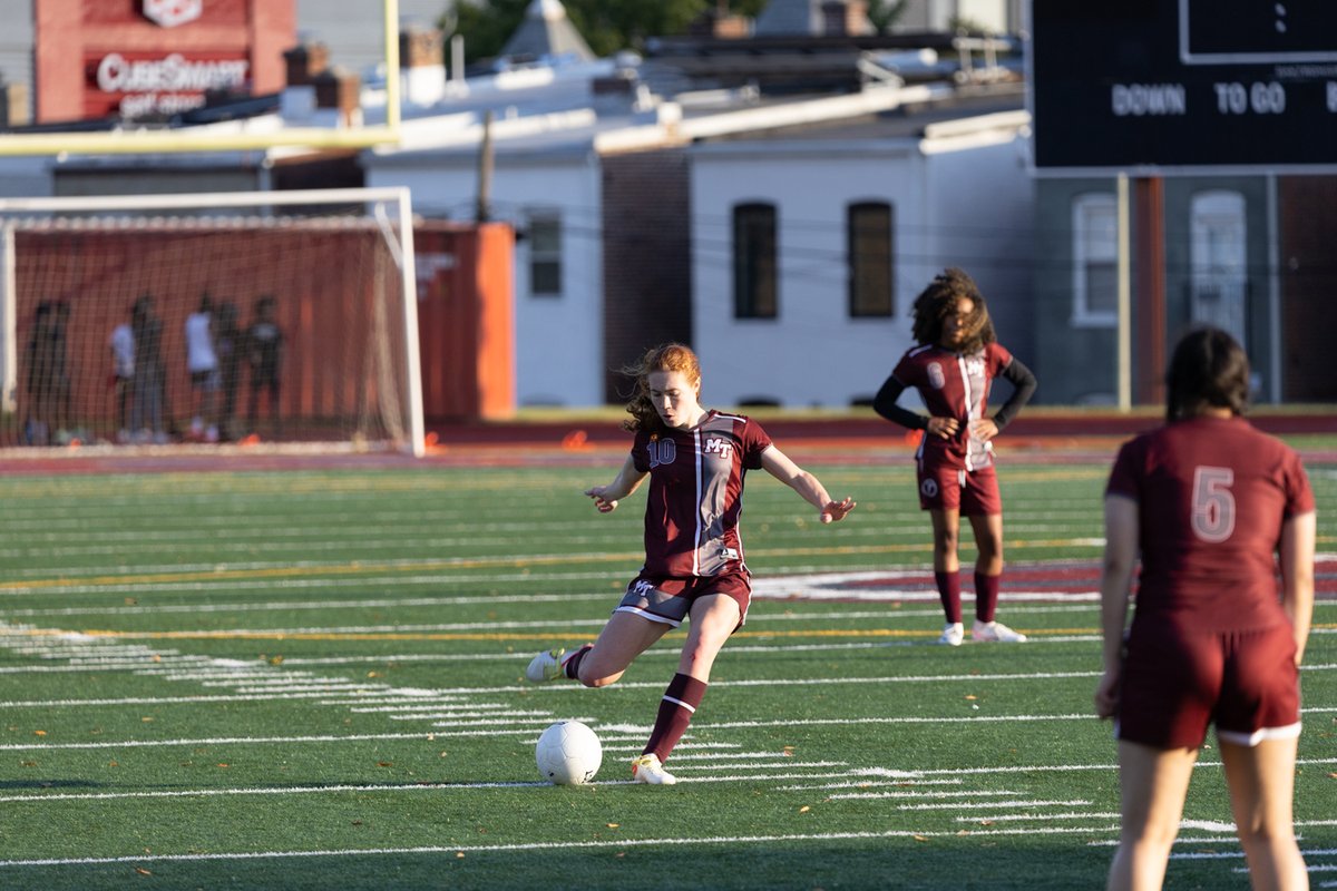 Soccer players competing for the ball